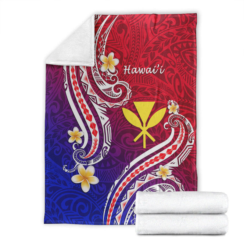 Hawaiian blanket folded with white border: red top, purple-to-blue bottom, white tribal scrolls