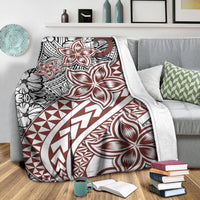 White Polynesian blanket featuring red flower tattoo motifs and geometric zigzag bands