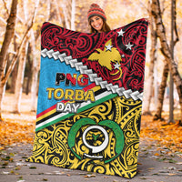 PNG Torba Day premium blanket laid flat, red-blue-yellow artwork with stars and “TORBA DAY” text