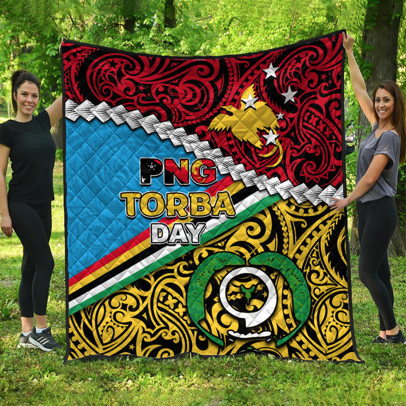 Multicolor quilt blanket with 'PNG TORBA DAY' graphic and star details