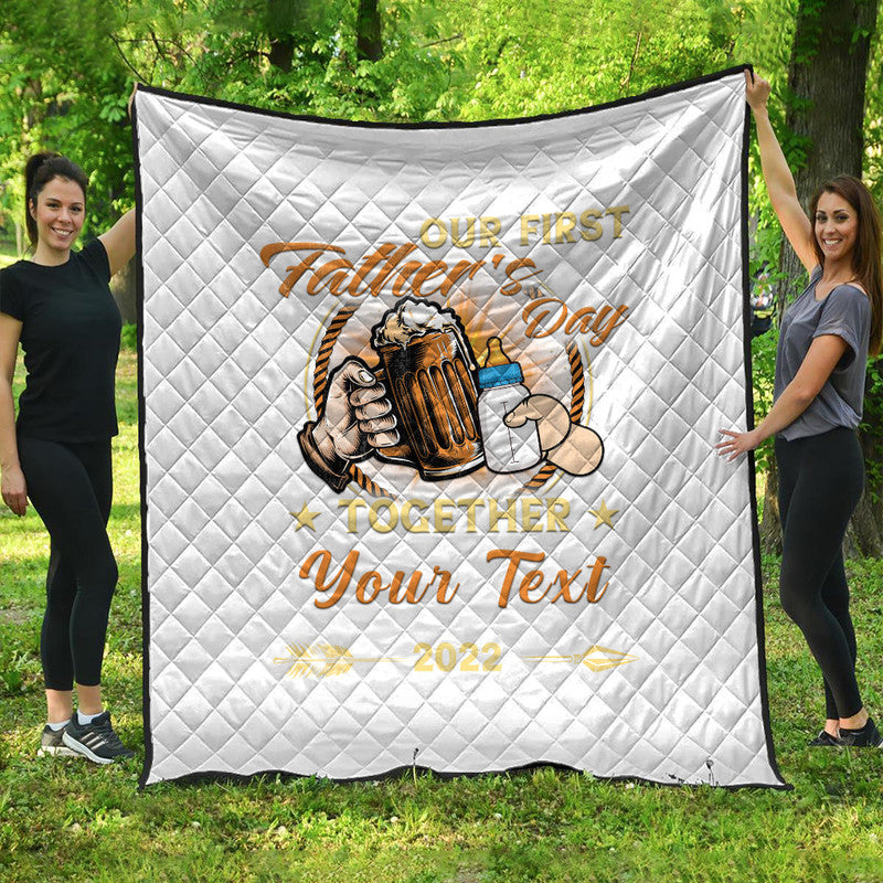 White quilt with diamond quilting and Our First Fathers Day beer mug graphic