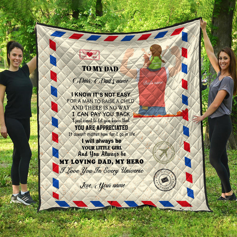 Beige quilt with “To my Dad” message, red/blue geometric border and heart stamp
