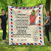 Beige quilt with “To my Dad” message, red/blue geometric border and heart stamp