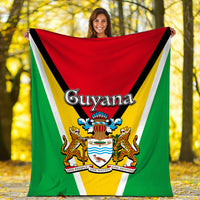 Guyana flag blanket fully spread outdoors, showing 'Guyana' text and national crest