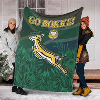Green “GO BOKKE!” rugby blanket with Springbok emblem and protea flower details