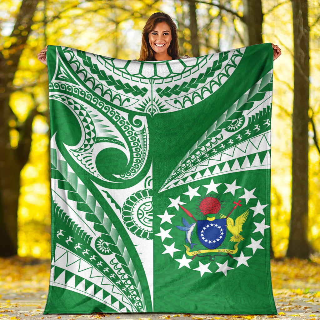 Green premium blanket featuring white tribal curves and a central star-and-emblem design