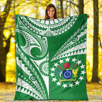 Green premium blanket featuring white tribal curves and a central star-and-emblem design