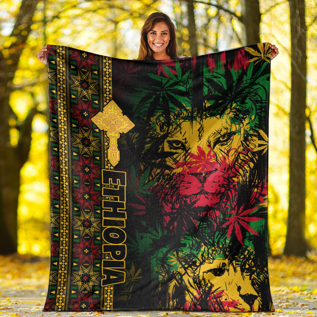 Lion reggae premium blanket spread on ground, black lion portrait with multicolor Ethiopian cross