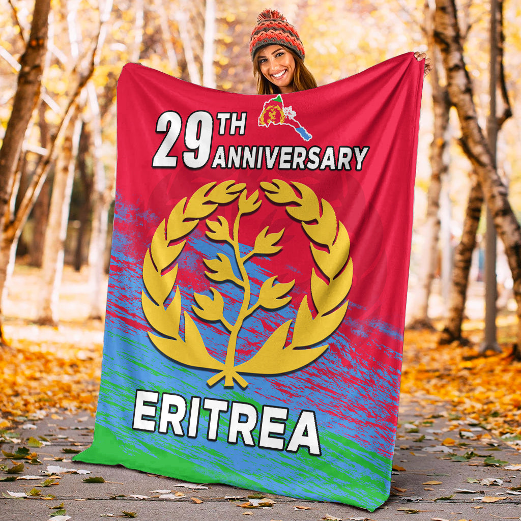 Red Eritrea 29th Anniversary blanket with gold tree emblem and ERITREA lettering