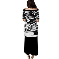 Long black puletasi dress, back view, 3/4 sleeves, tribal white patterns