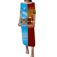 Blue and red long dress with tapa-style geometric print, wide neckline and elbow sleeves