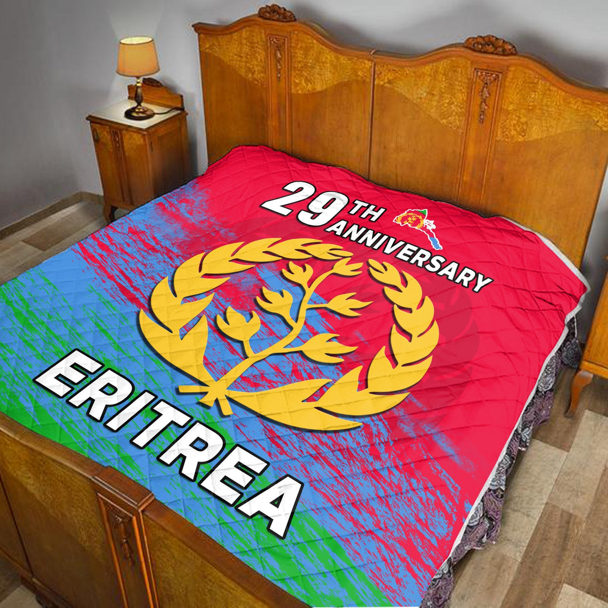 Red Eritrea 29th Anniversary quilt with tree emblem and 'Eritrea' text
