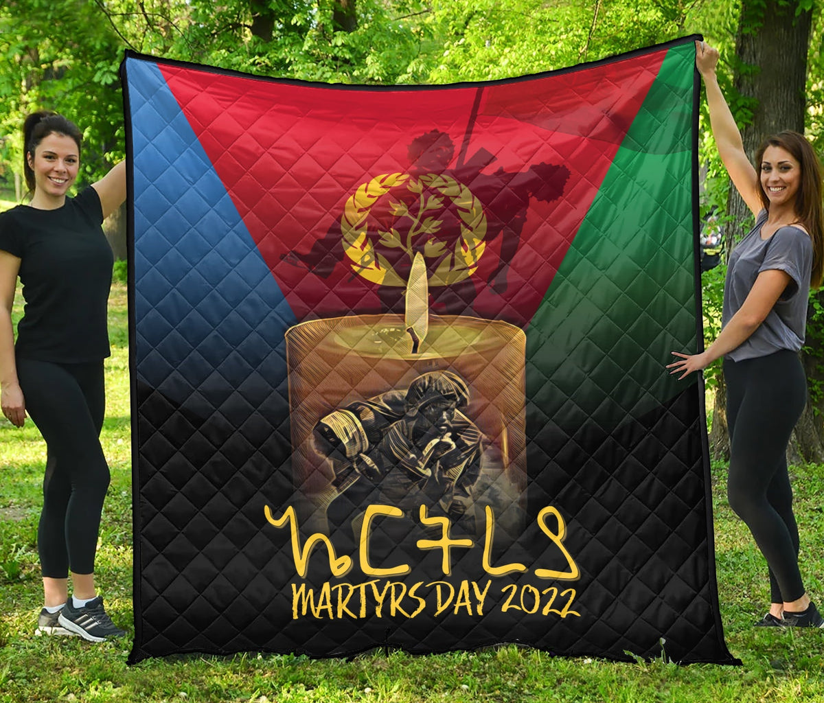Quilt blanket with Eritrean flag colors, gold emblem and “Martyrs Day 2022” text