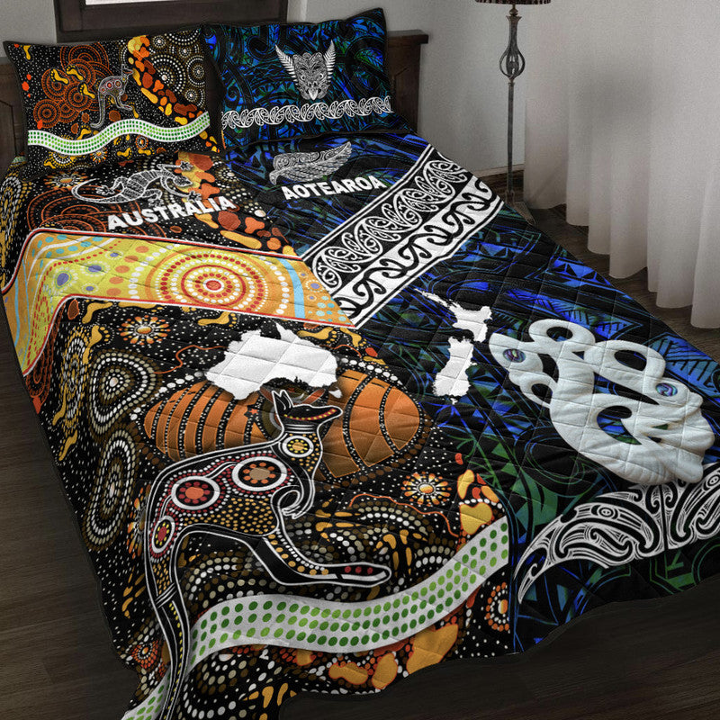 Blue, black and white quilt set with patterned pillows and animal silhouettes