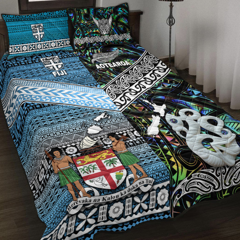 Blue quilt bed set with tribal patterns and white sea-creature graphics, plus matching pillow