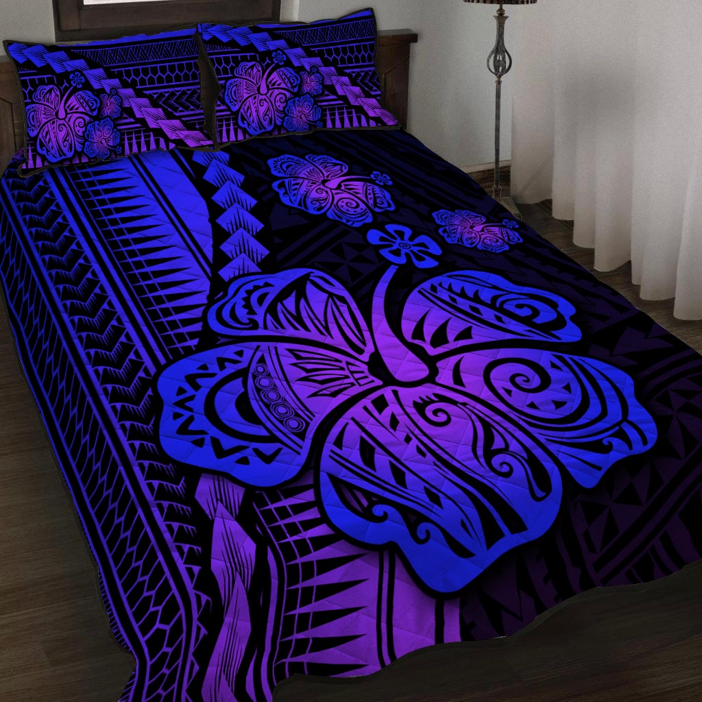 Purple quilt bed set with hibiscus and tribal patterns, matching pillow shams
