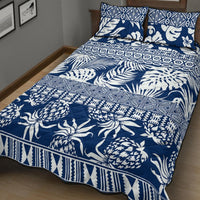 Blue and white tropical leaf quilt bed set with two matching patterned pillow covers
