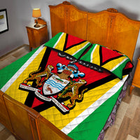 Guyana flag quilt bed set over bed, showing red crest with jaguars and coat of arms