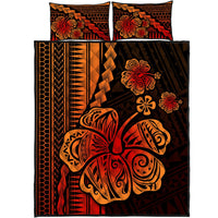 Red and black hibiscus quilt bed set with orange tropical design; two matching pillowcases
