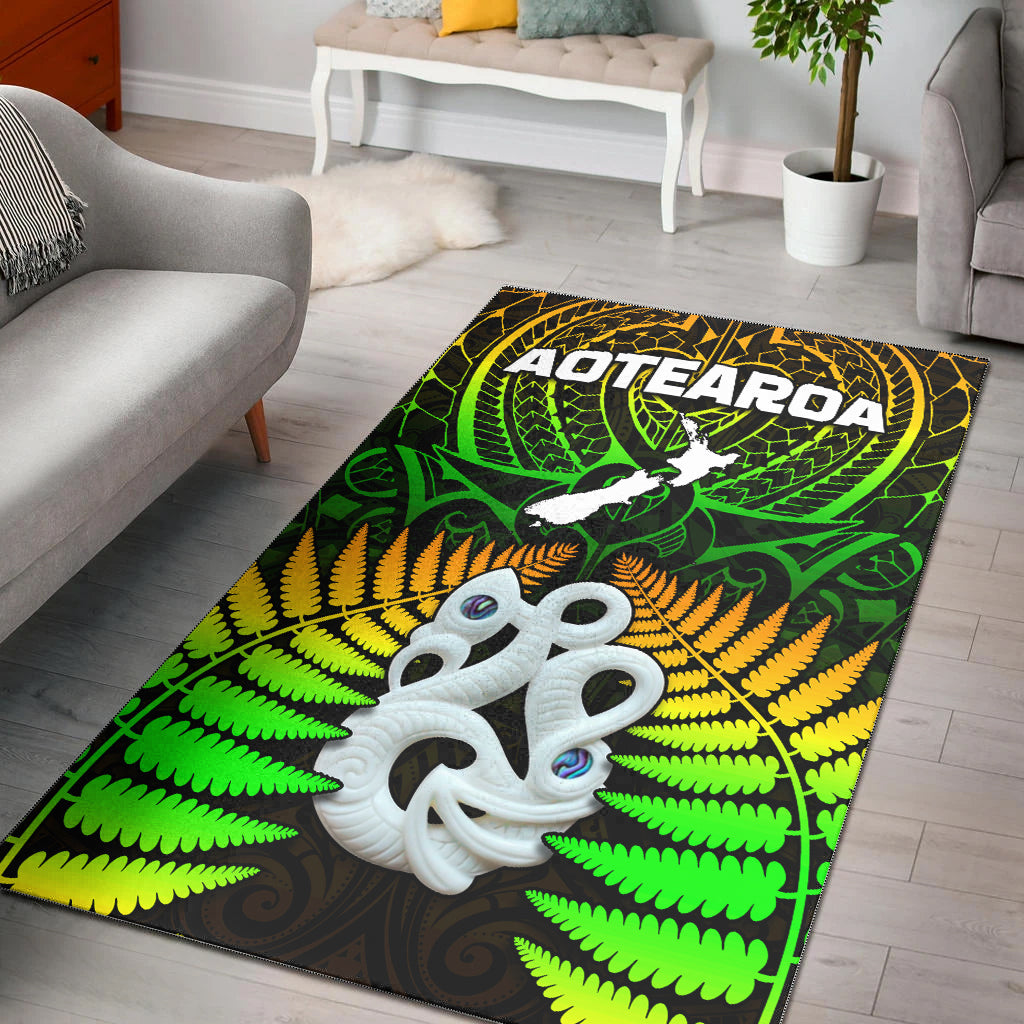 Aotearoa fern area rug in green with Hei Tiki face and fern leaves