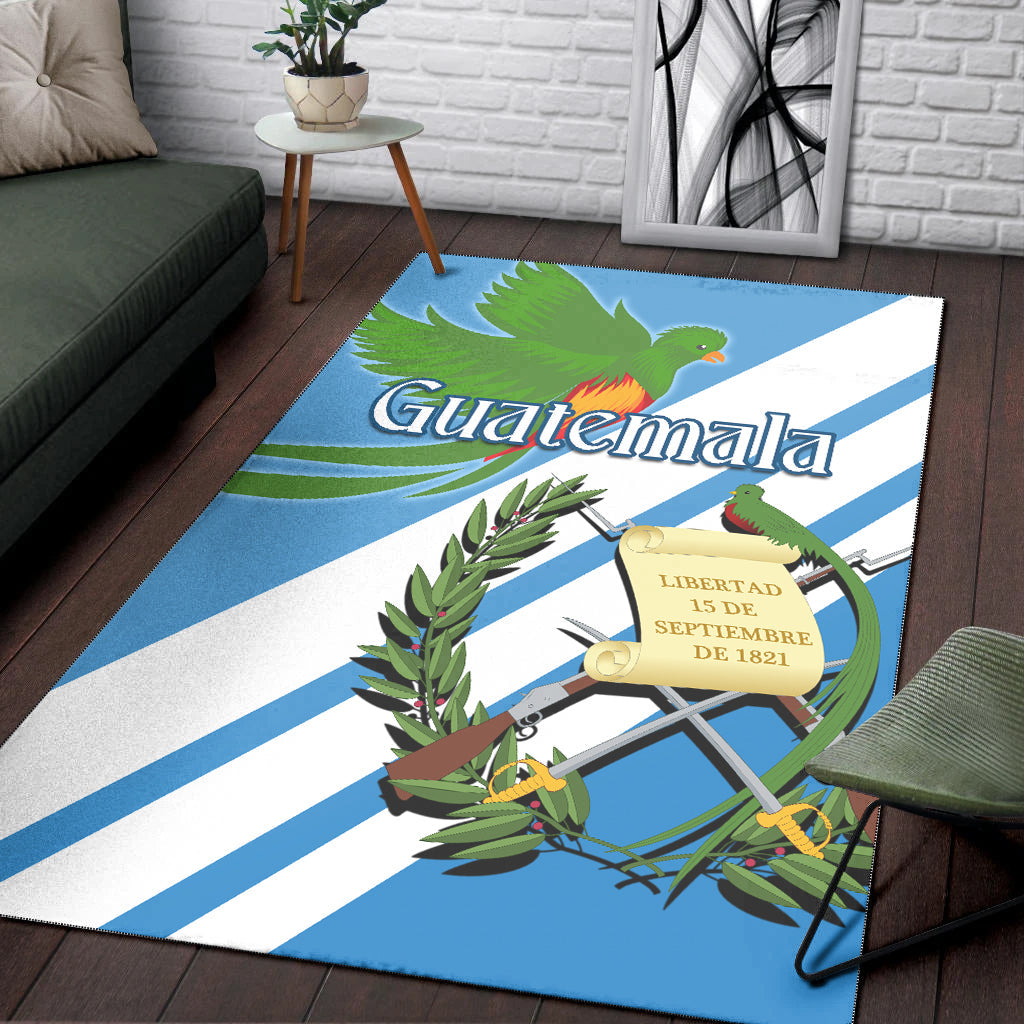 Blue area rug with quetzal bird, Guatemala lettering, and ornate banner illustration