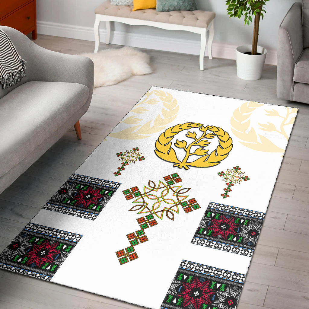 White area rug with gold tree emblem, colorful squares, and patterned border