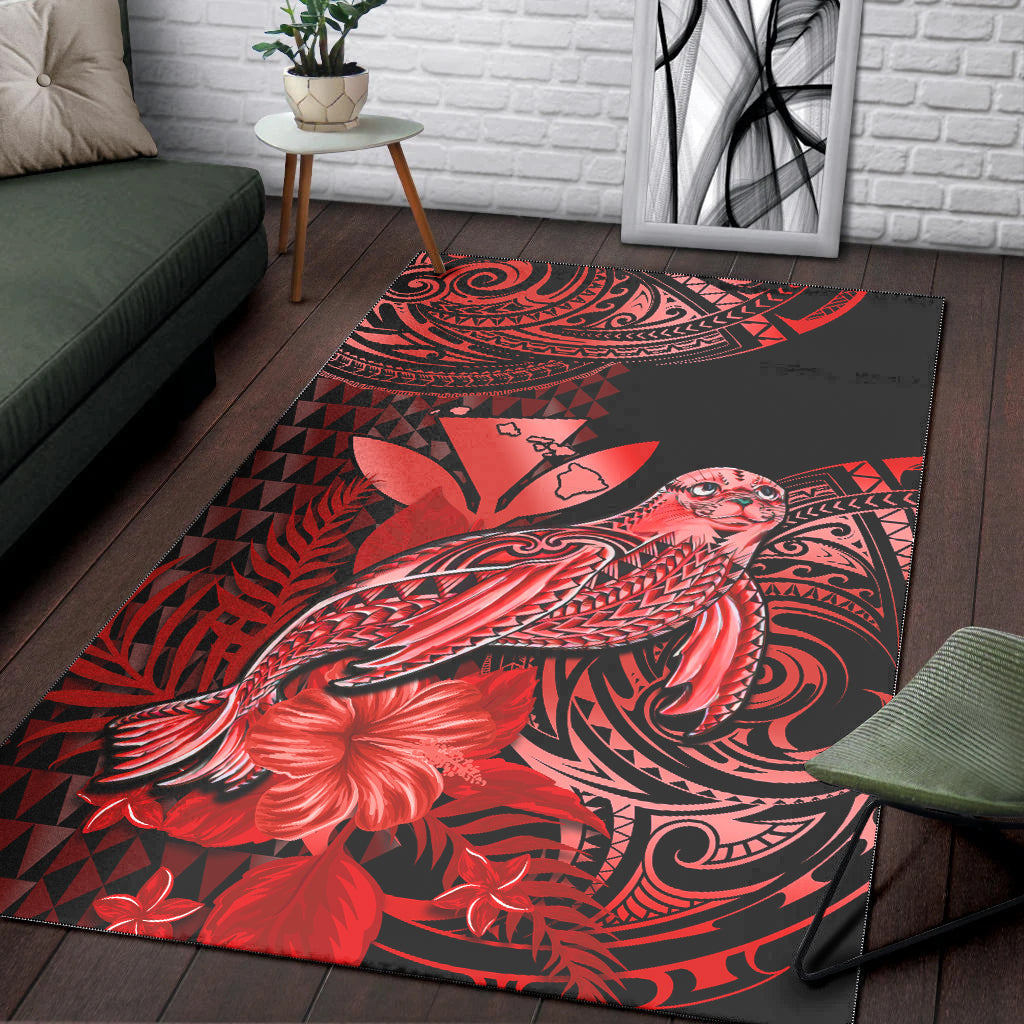 Red and black area rug with stylized monk seal and tribal swirl patterns