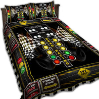 Racing quilt bed set with black base, checkered flags, traffic light buttons, and lane graphics