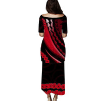 Long back-view red-and-black patterned dress with 3/4 sleeves