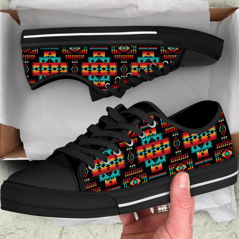 Low-top canvas sneaker with bold Native tribes geometric multicolor pattern, black sole