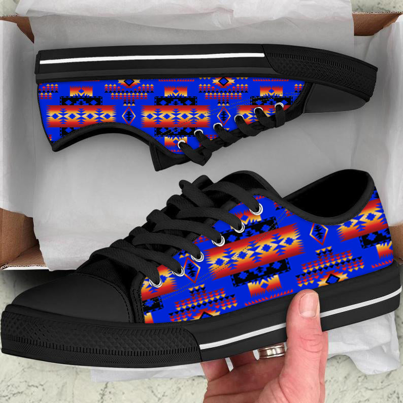 Colorful tribal patterned low-top canvas shoes, blue/red upper, black sole, black laces