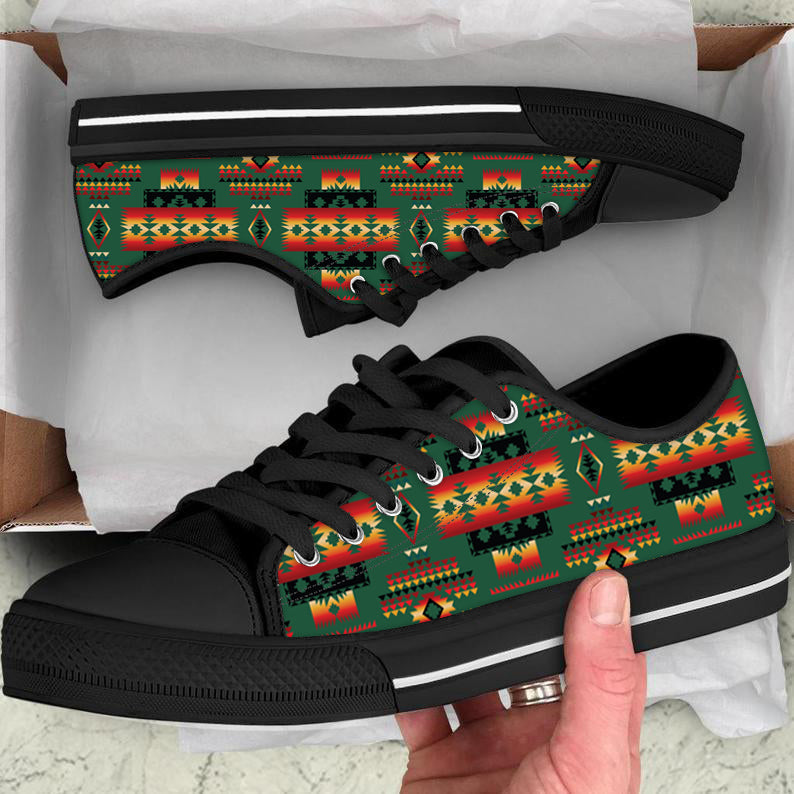 Low-top canvas shoes with geometric tribal pattern, black sole and white stripe