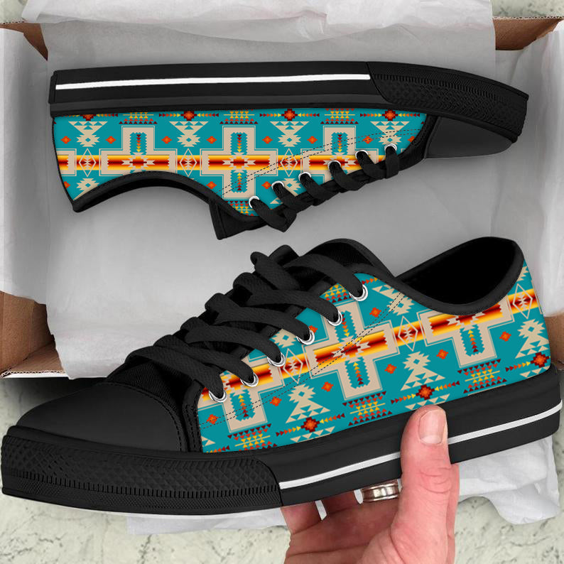 Turquoise low-top canvas shoes with colorful native cross pattern, black laces/sole