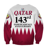 Light gray back sweatshirt with QATAR 143rd Independence Anniversary text and triangular pattern