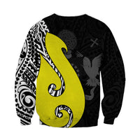 Black crewneck sweatshirt with bold lime fish-hook and black-on-black leaf texture