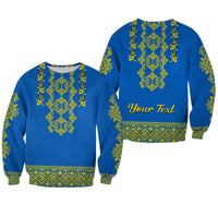Unisex blue crewneck sweatshirt set with yellow-green folk pattern; one shows 'Your Text'