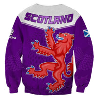 Purple sweatshirt with “SCOTLAND” text and red lion thistle crest graphic, crewneck