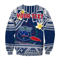 Blue and white sweatshirt with custom YOUR TEXT, shield graphic, and plumeria flowers