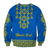 Unisex blue crewneck sweatshirt back with yellow-green folk embroidery and 'Your Text'