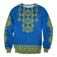 Unisex blue crewneck sweatshirt with yellow-green folk embroidery on chest and sleeves
