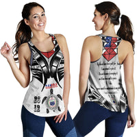 White racerback tank worn front and back, starburst black graphic with red/blue details and text