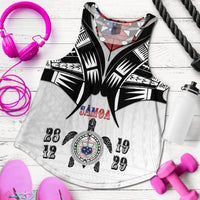 White racerback tank with black geometric starburst and colorful date/graphic print, sleeveless
