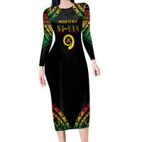 Black long-sleeve midi dress with Polynesian pattern panels and graphic logo at chest