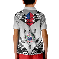 Light gray polo shirt back with central circular emblem under shield graphic in black, red, blue