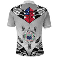 Light gray polo shirt back with large shield graphic and central emblem, black red blue