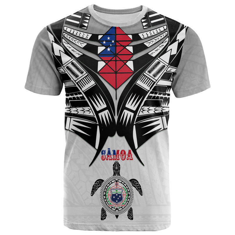 Light gray kid T-shirt with black-and-white tribal wings and red/blue emblem on front