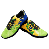 Low-top lace-up sneakers with yellow, green, and blue upper; black laces and black heel collar