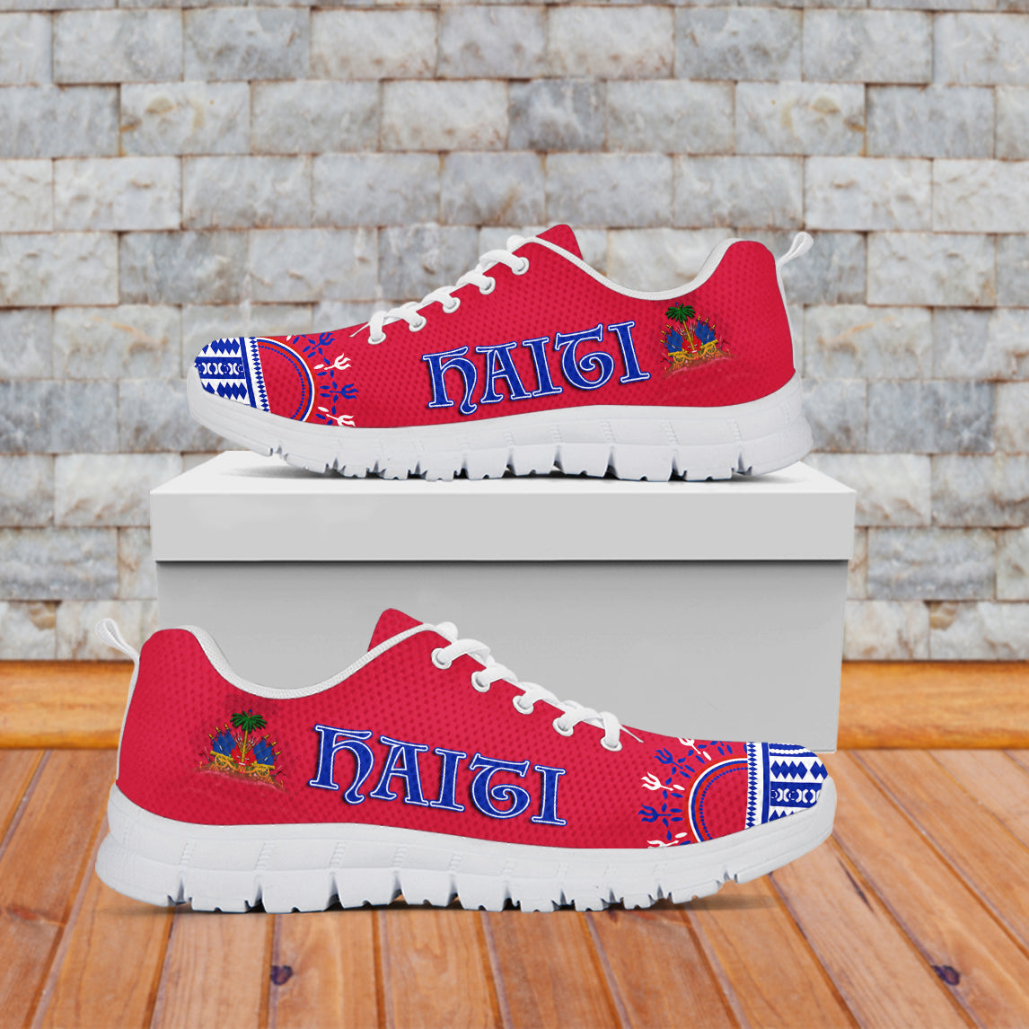 Red low-top sneakers with “Haiti” lettering, blue pattern accents, white sole, white laces