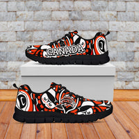 Black-sole sneakers with Canada text and Haida-style red, black, white graphics