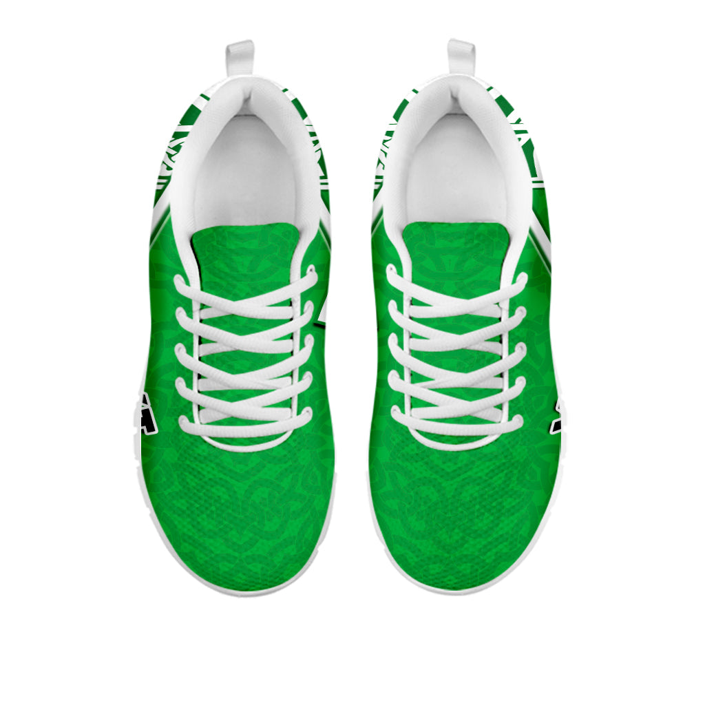Pair of green Wales sneakers with white laces and celtic knot trim on the side